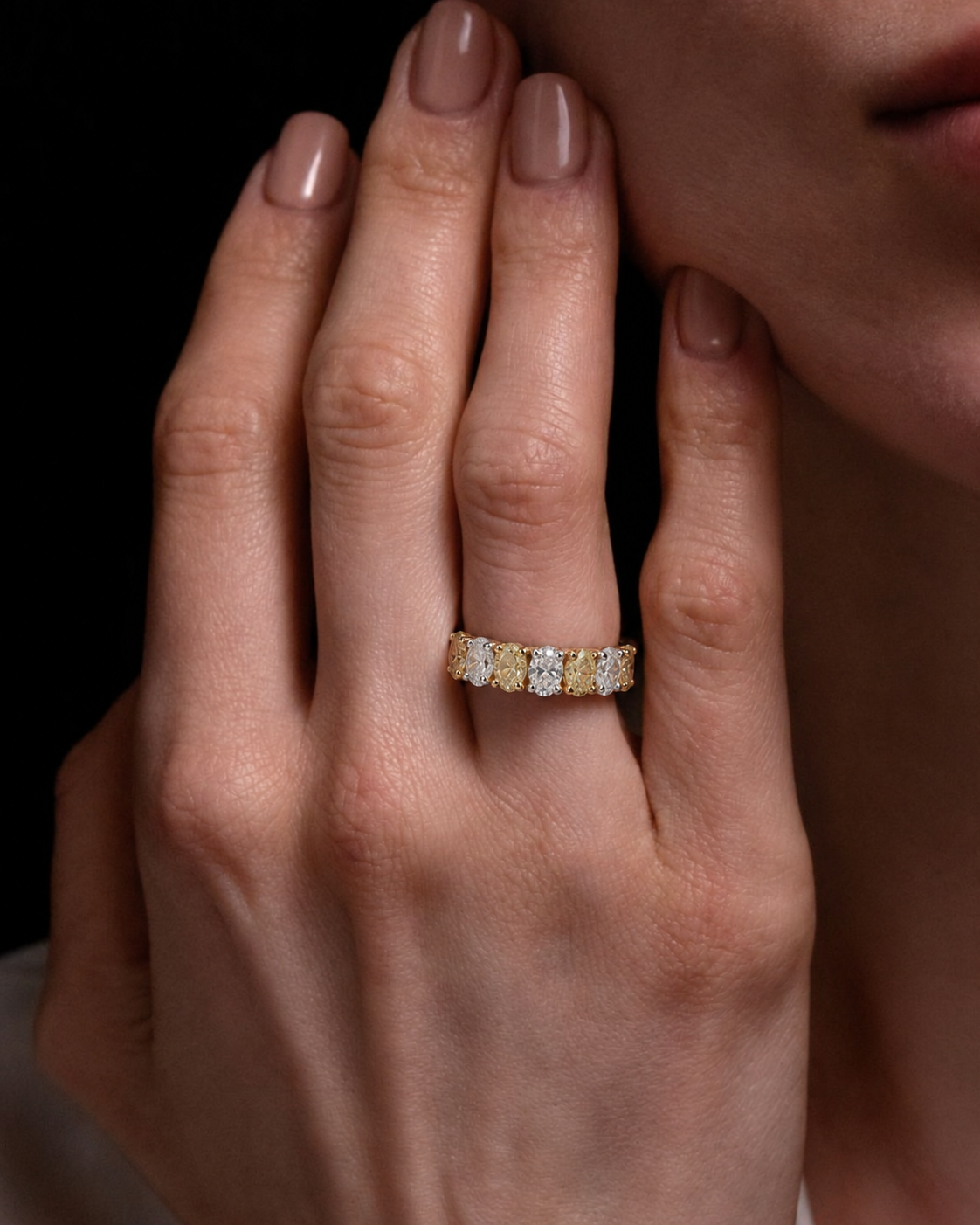 Emerald cut diamond ring on model hand